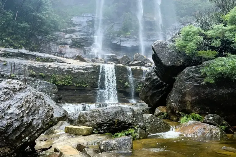 Water cascading over sandstone ledges