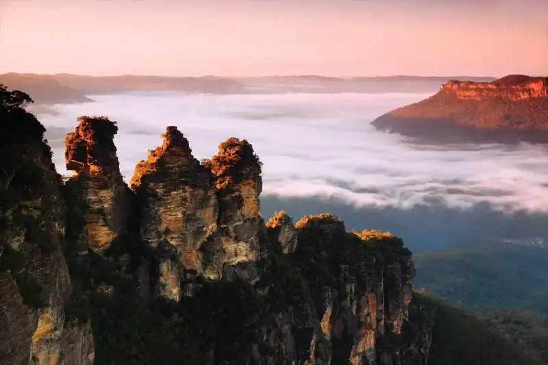 Three Sisters above low cloud